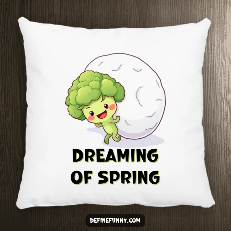 Funny pillow design of an optimistic broccoli floret character earnestly pushing a massive snowball uphill.